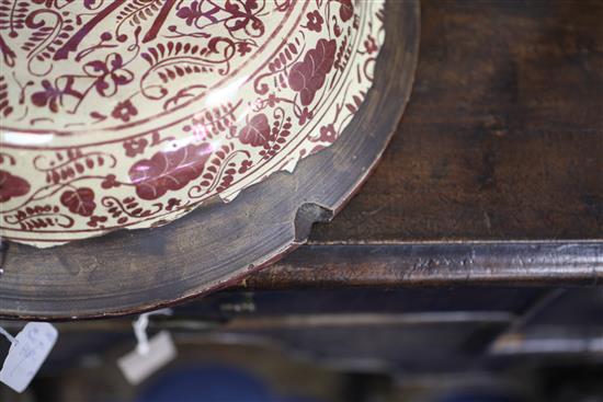 A Hispano-Moresque copper lustre and blue decorated charger, probably Manises 18th century, 35.5cm, glaze losses to the underside